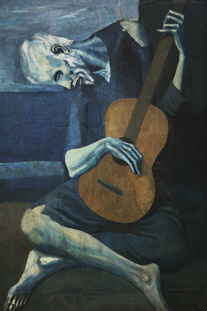 Old guitarist - Chicago - From Wikipedia